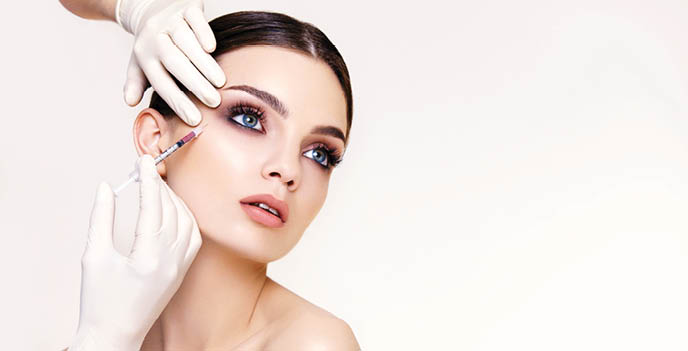 Beautiful woman gets injections  Cosmetology  Beauty Face