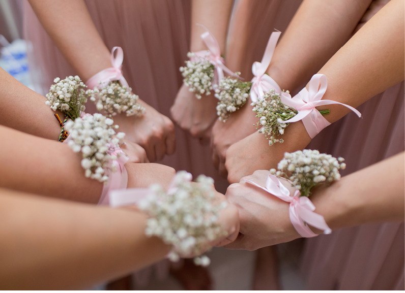 Wrist Corsages, bridesmaids wearing wrist corsage made from flowers 