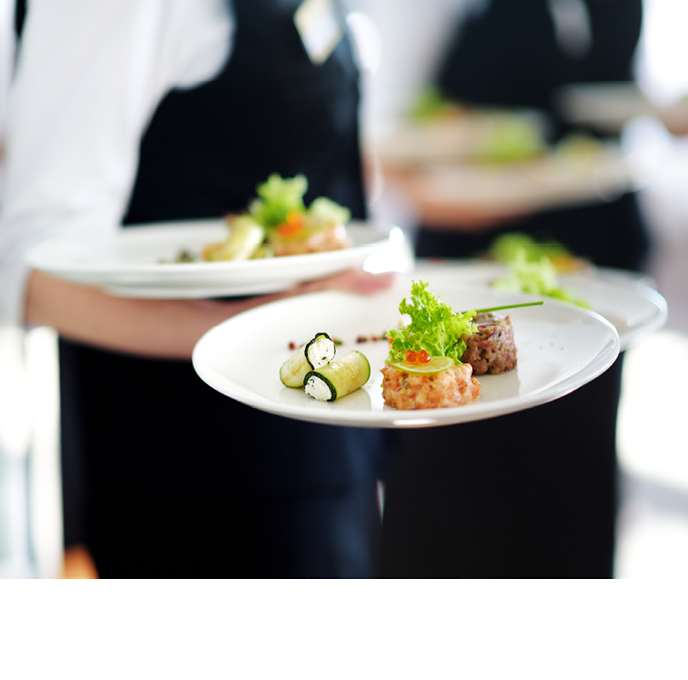 Waiter carrying plates with meat dish on some festive event, party or wedding reception
