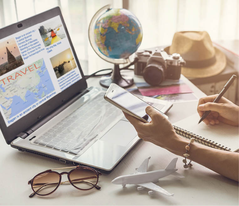 Young woman planning vacation trip and searching information or booking an hotel on a smart phone and laptop, Travel plan concept