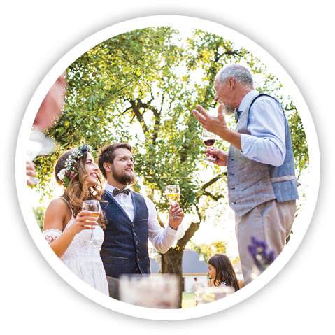 A senior man making speech at wedding reception outside in the background 