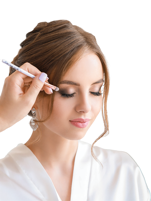 Professional makeup artist working with young bride at home