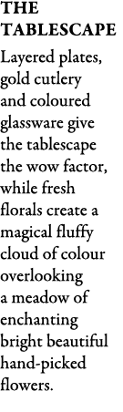 The Tablescape Layered plates, gold cutlery and coloured glassware give the tablescape the wow factor, while fresh fl...