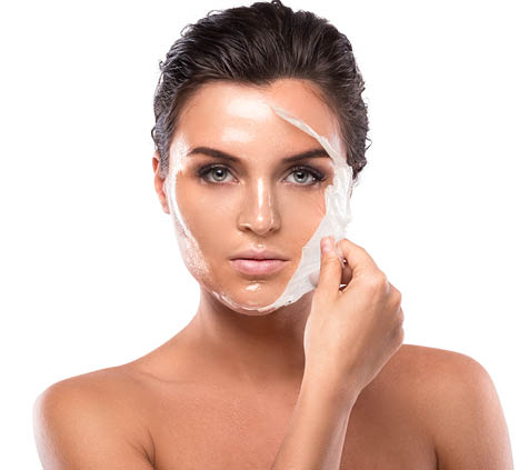 Young and beautiful woman with Purifying Mask on her face