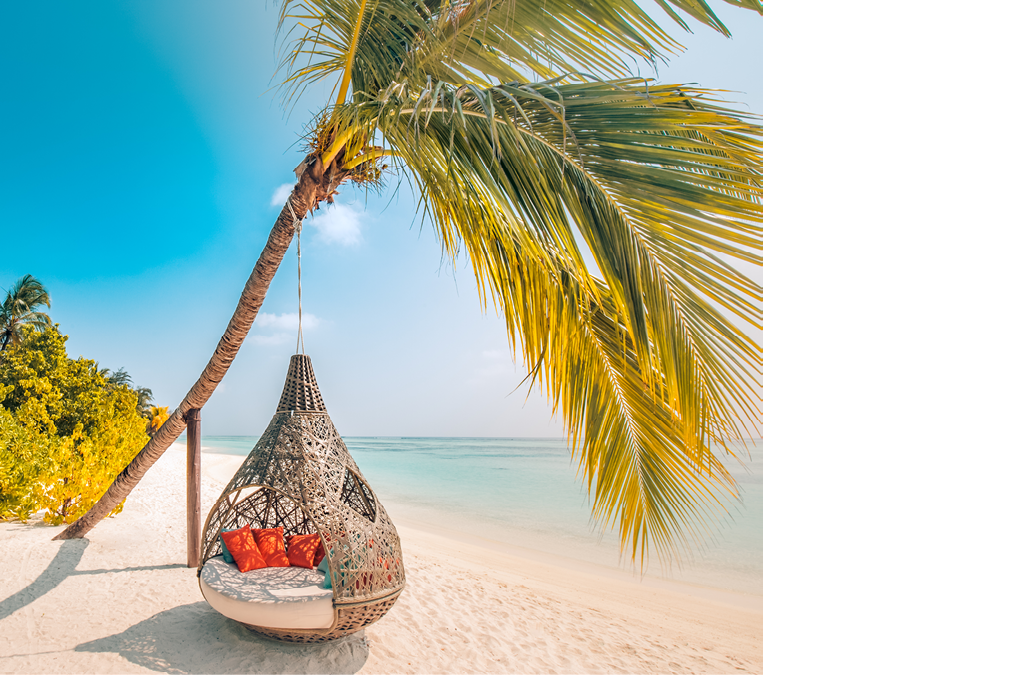 Beautiful tropical Maldives beach under cloudy sky with swings or hammock on coconut palm. Luxury vacation concept
