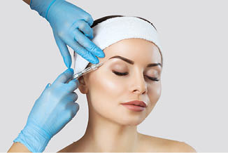 The doctor cosmetologist makes the Rejuvenating facial injections procedure for tightening and smoothing wrinkles on the face skin of a beautiful, young woman in a beauty salon Cosmetology skin care 