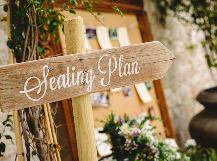 Wooden signposts at events and weddings with words Seating Plan 