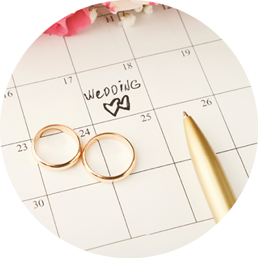 Word wedding, two hearts and gold rings on calendar with sweet rose bouquet  Love, invitation, advertisement, romantic background concept, copy space