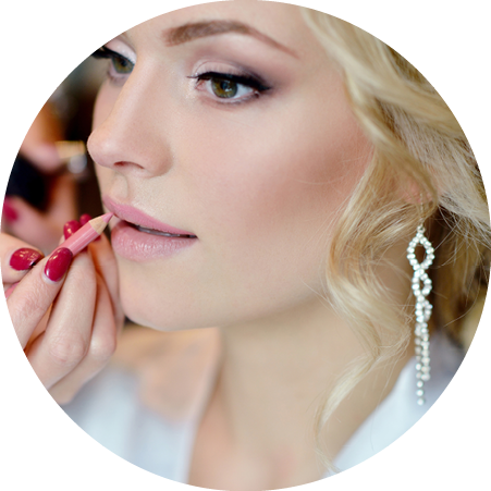 Wedding makeup artist making a make up for bride  Beautiful sexy model girl indoors  Beauty woman with curly hair  Female portrait  Bridal morning of a cute lady  Close-up hands near face