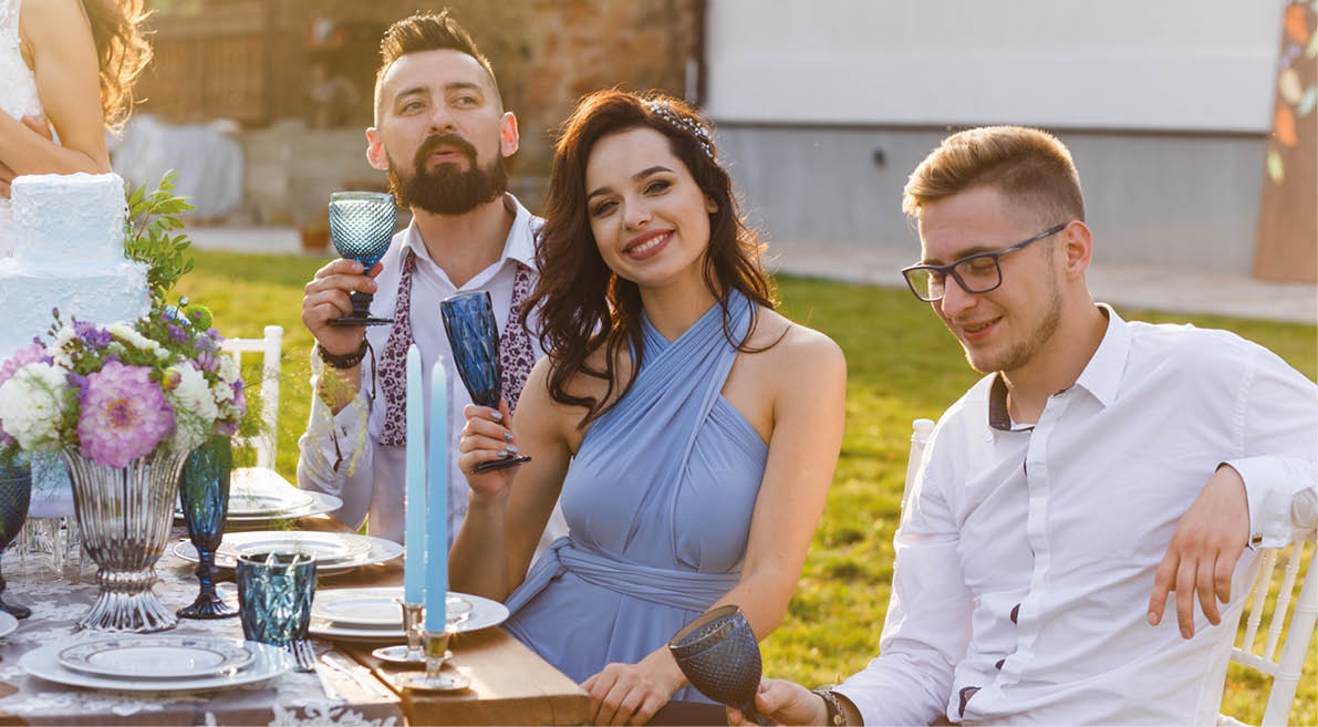 The newmarried couple and guests enjoy themselves at the Banquet table