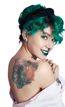 Woman with creative green coloring hair and makeup, toxic strands of hair  Bright color curly hair on the girl head, professional makeup  Woman with tattoo