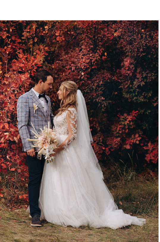 Wedding couple with bouquet with roses and spikelets and pampas grass .Boho style wedding