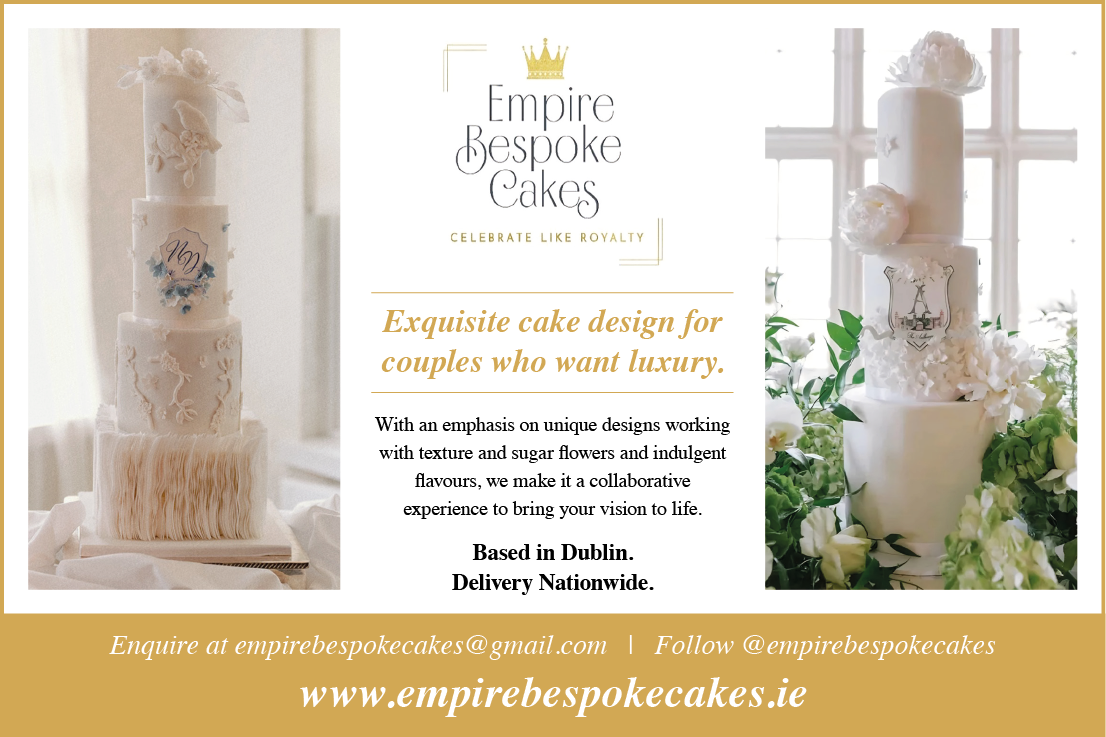 A white cake with a crown on top. Description generated by AI