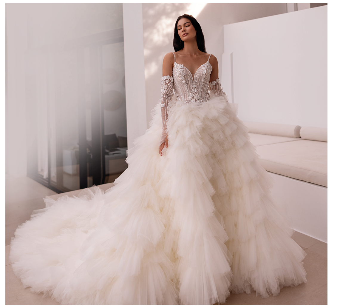 A woman in a white dress with a train. Description generated by AI