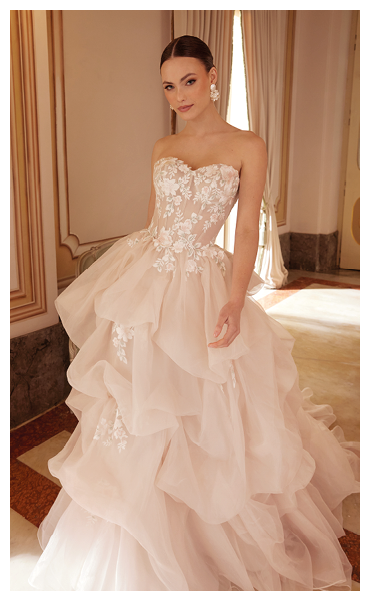 A woman in a pink dress. Description generated by AI