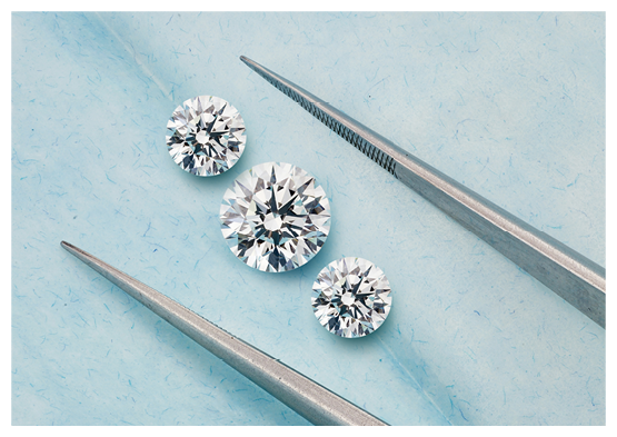 A pair of scissors with a diamond on top. Description generated by AI