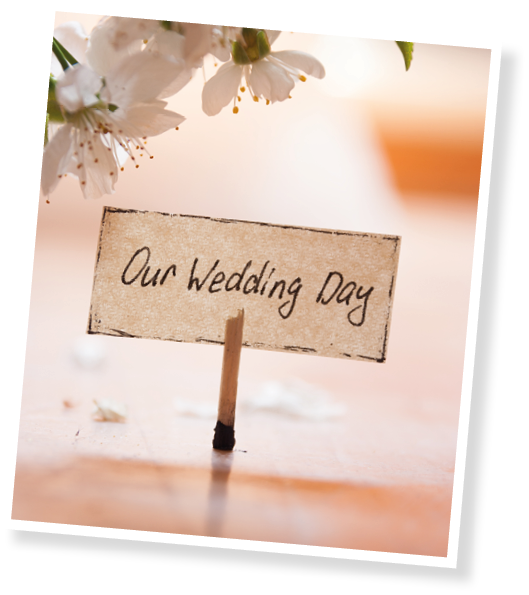 A sign that says “Our Wedding Day" on a table. Description generated by AI