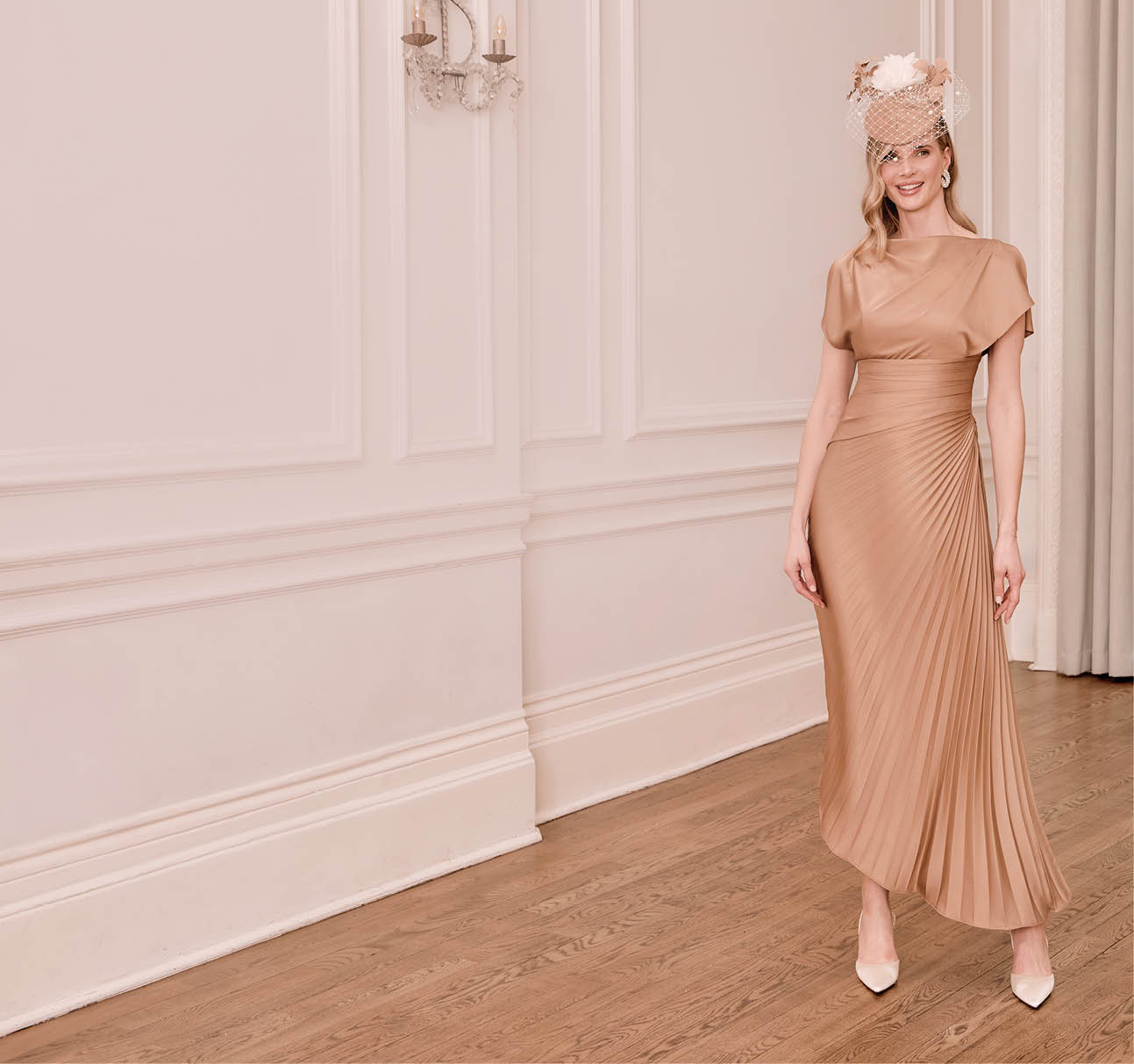 A woman wearing a brown dress and a hat. Description generated by AI