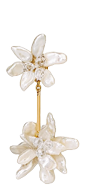 Two white earrings with gold accents. Description generated by AI
