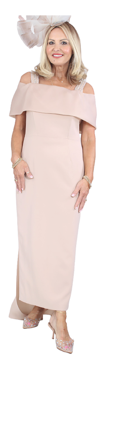 A woman wearing a pink dress and a hat. Description generated by AI