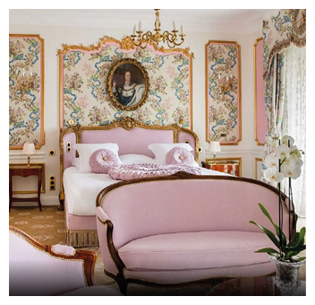 A bedroom with a pink bedspread and a white headboard. Description generated by AI