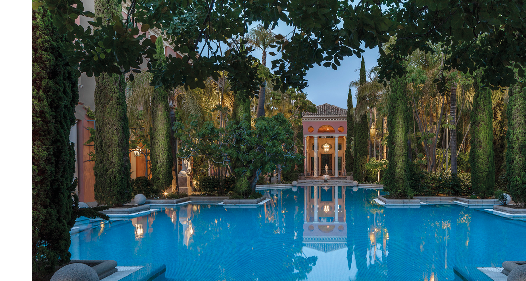 A large pool with a reflection of a building. Description generated by AI