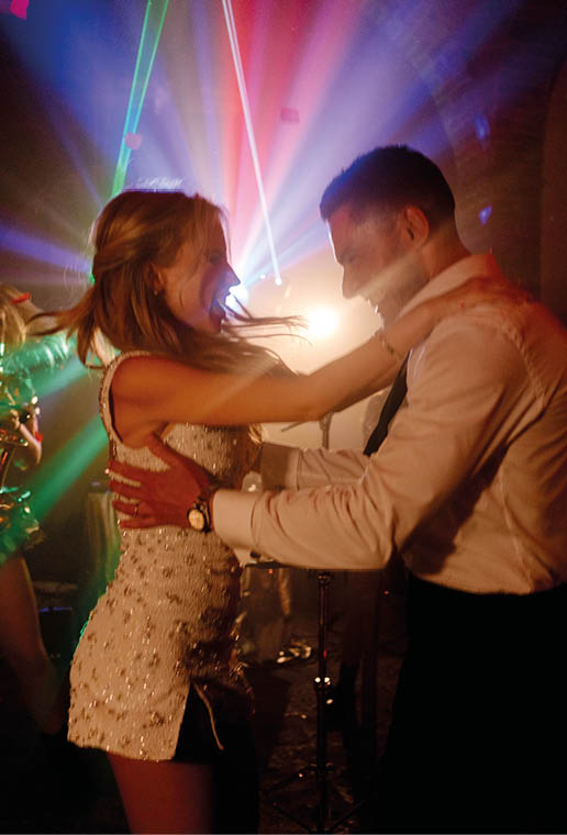 A man and woman are dancing in a club. Description generated by AI