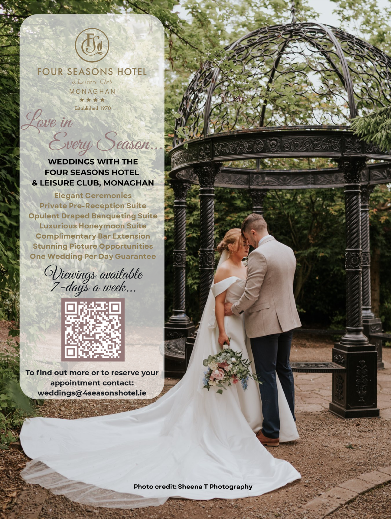A person in a wedding dress and a person in a suit stand closely together under a decorative metal gazebo in a garden setting, with a wedding advertisement for the Four Seasons Hotel Monaghan displayed alongside them. Description generated by AI