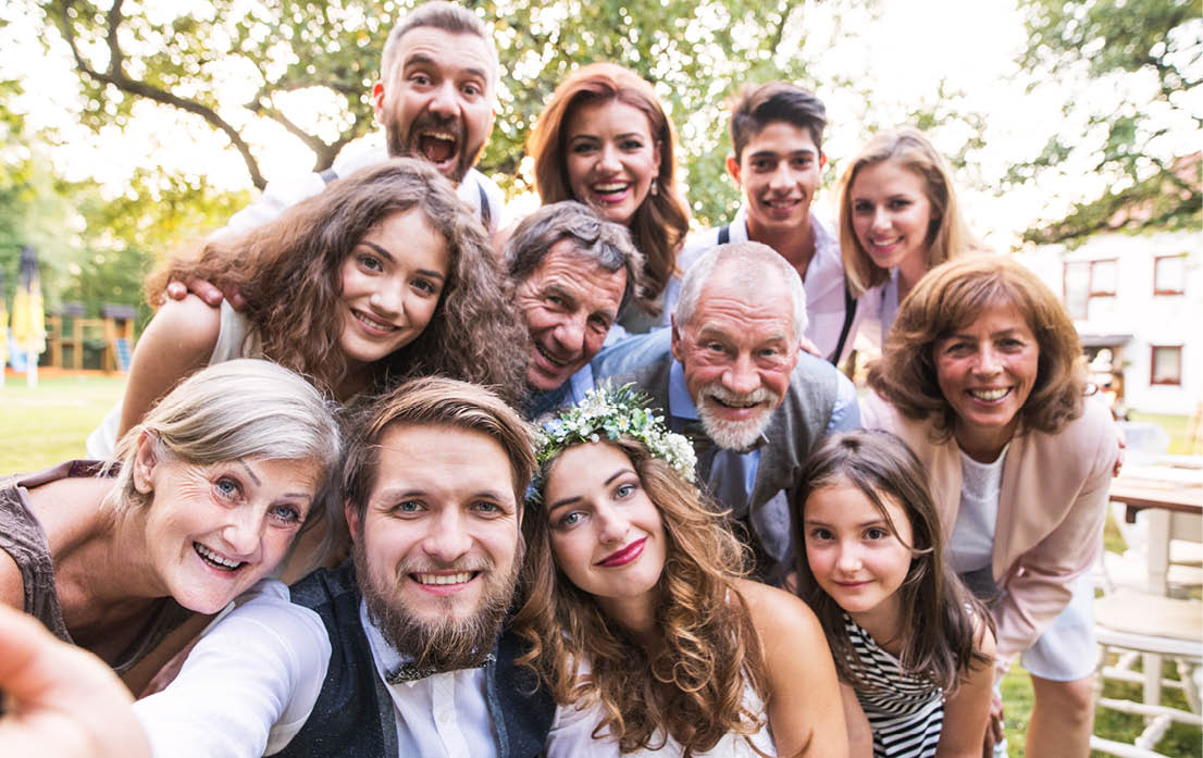 A group of people posing for a picture. Description generated by AI