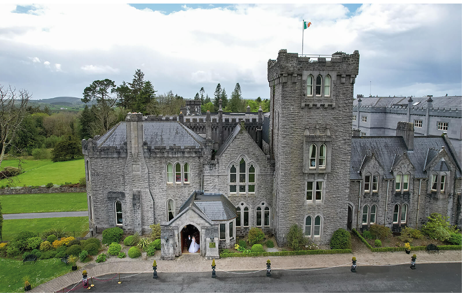 A large castle with a flag on top. Description generated by AI