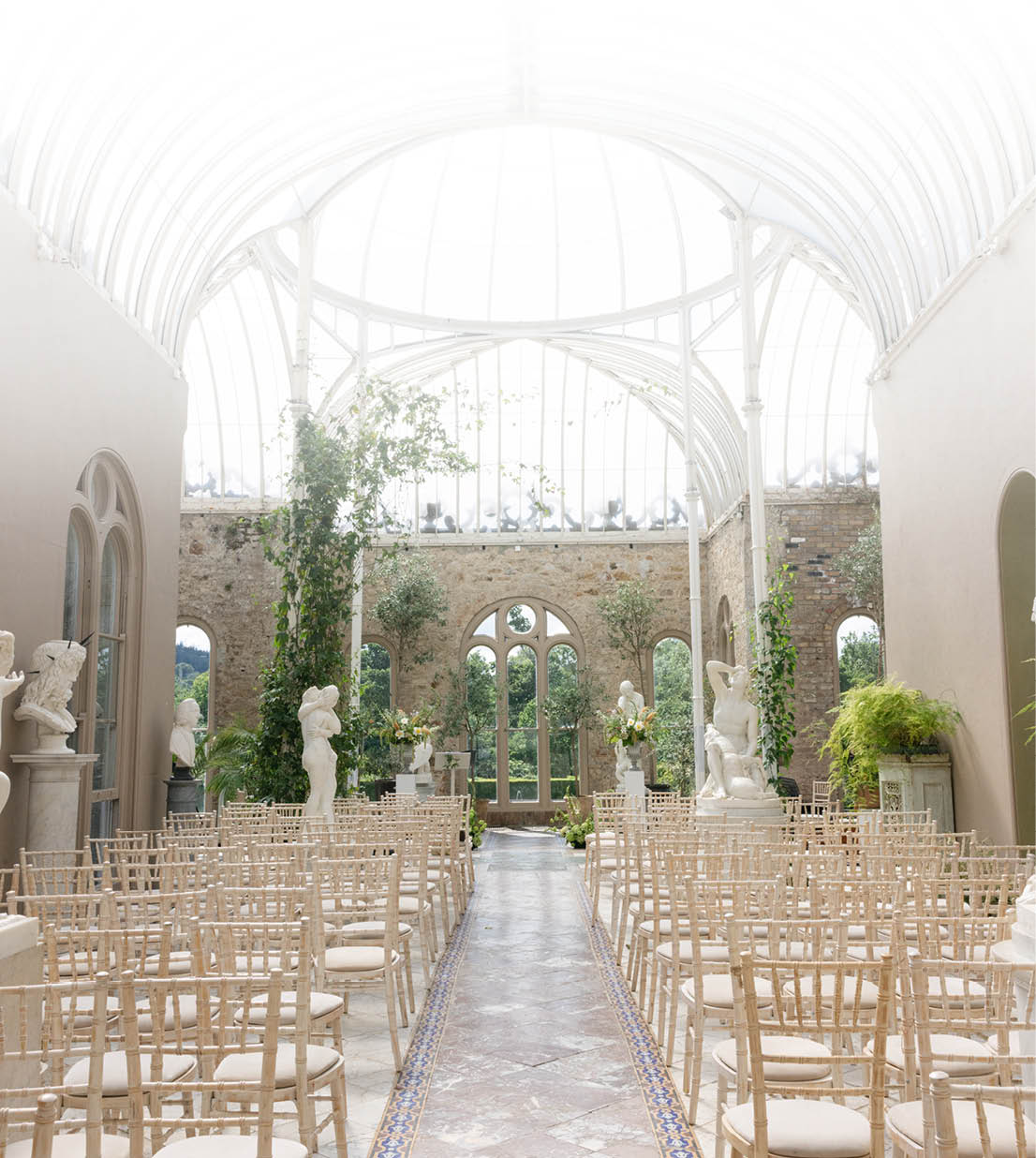 A large room with many chairs and a glass ceiling. Description generated by AI