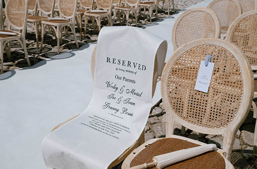 A chair with a white cloth on it. Description generated by AI