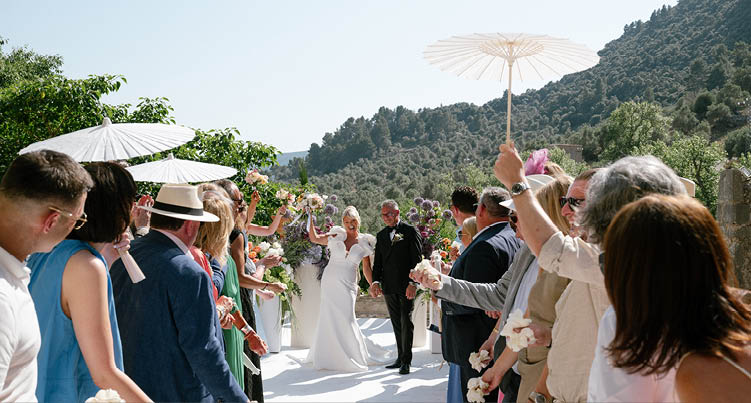 A group of people are standing on a white path. Description generated by AI