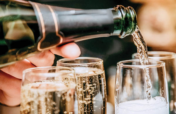 Glass glasses of champagne, people celebrating an important event, a festive toast