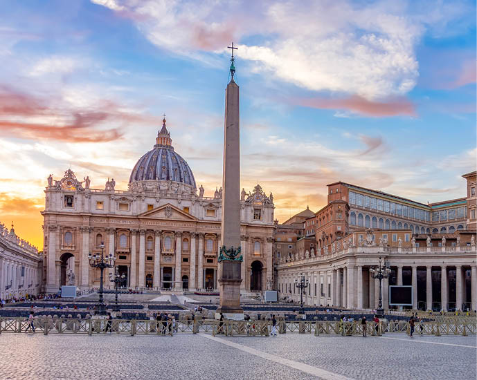St. Peter's basilica in Vatican at sunset, center of Rome, Italy (translation “In honor of prince of Apostles; Paul V Borghese, Pope, in year 1612 and 7th year of his pontificate)