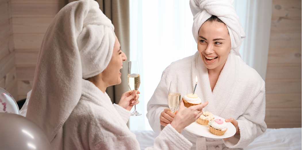 Excited female celebrating birthday with friend of her