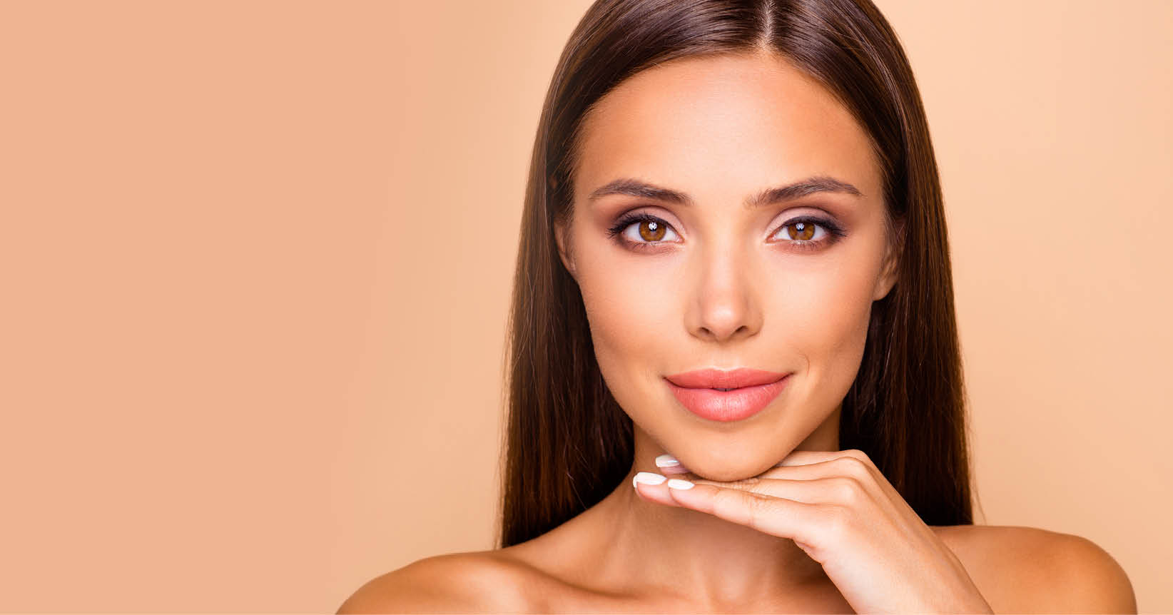 Brown-haired charming well-groomed dreamy leisure lifestyle lady with her naked shoulders she hold hand under chin look at camera isolated on pastel beige background with copy space for text