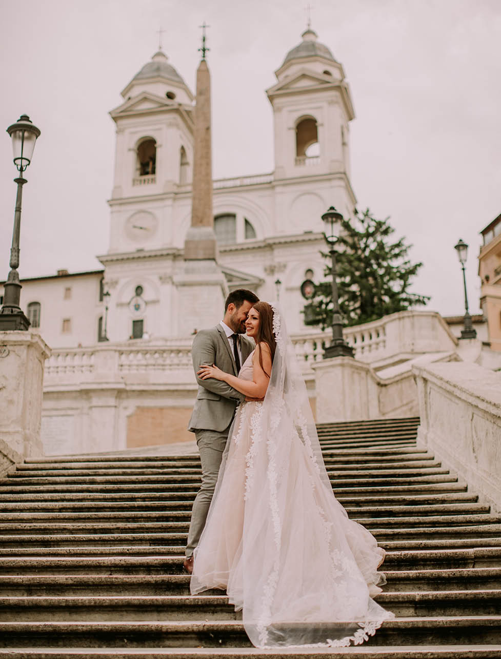 Young wedding couple on Spanish stairs in Rome, Italy