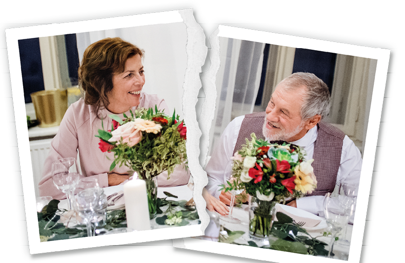 A young couple with parents sitting at a table on a wedding, looking at each other.