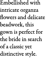 Embellished with intricate organza flowers and delicate beadwork, this gown is perfect for the bride in search of a c...