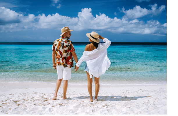 Playa Porto Marie beach Curacao, a white tropical beach with turqouse water in ocean Caribbean sea, a couple of men and women on vacation in Curacao