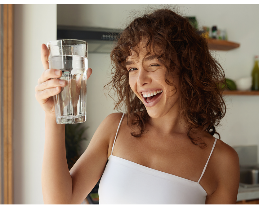 Healthy Lifestyle. Portrait Of Happy Smiling Young Woman With Glass Of Fresh Water. Healthcare. Drinks. Health, Beauty, Diet Concept. Healthy Eating. 