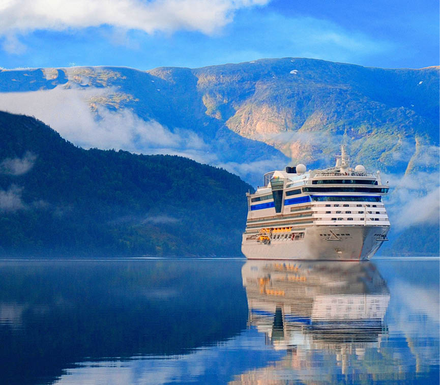 Ulwik. Cruise ship anchored in Ulwik fjord in Norway. Amazing nature view with fjord and mountains. Beautiful reflection. 