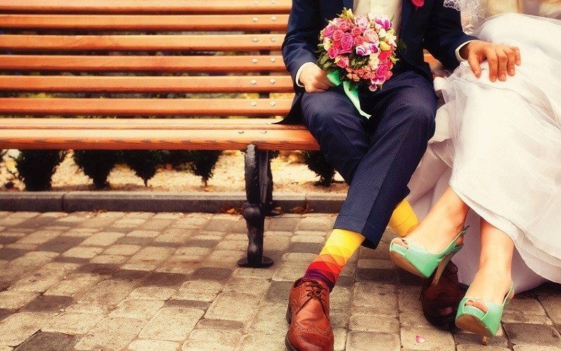 bride and groom on a bench