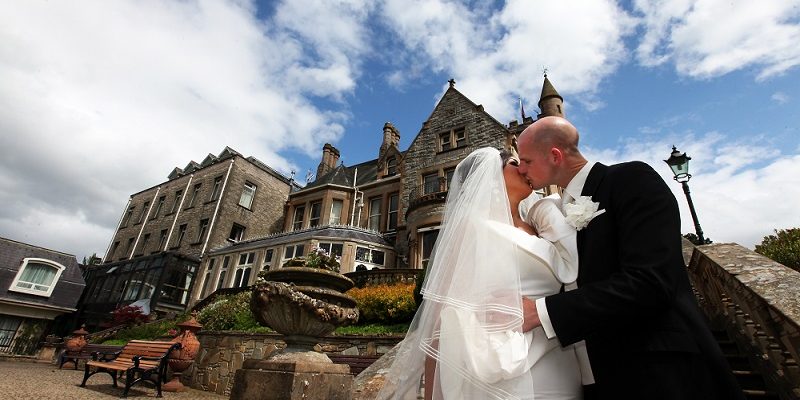 couple kiss under blue sky