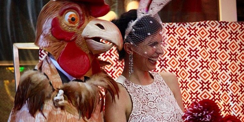 The groom wore a chicken head and the bride wore bunny ears