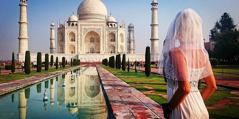 Heartbroken bride travels the world in her wedding dress