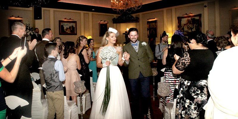bride and groom walking down aisle