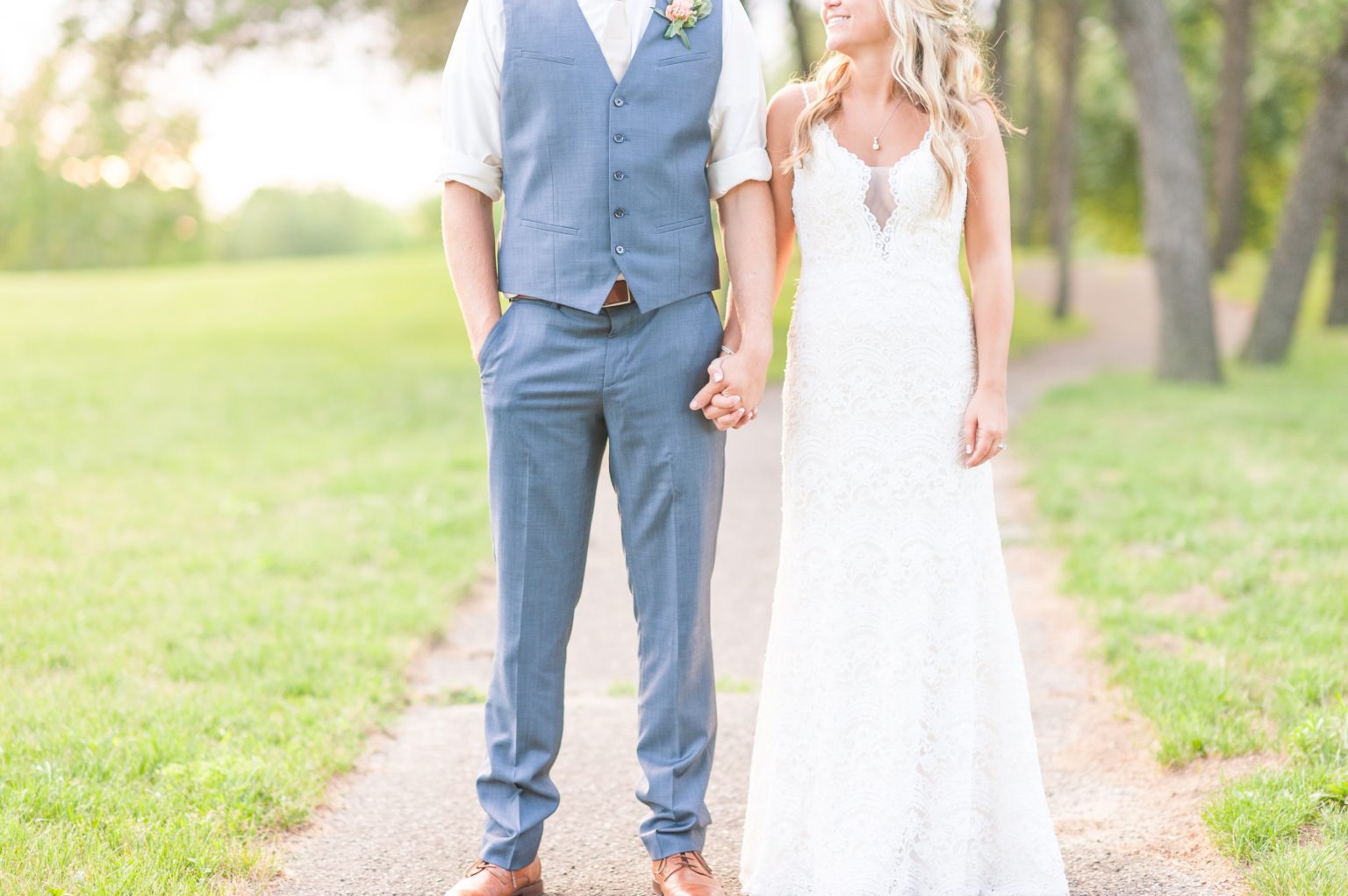bride and groom holding hands