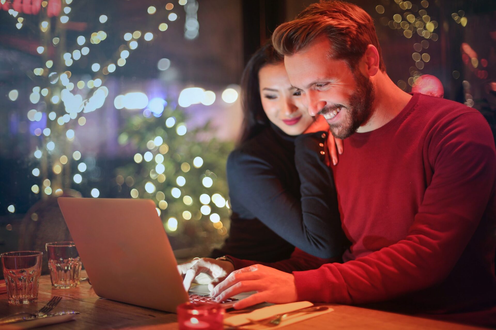 couple using laptop